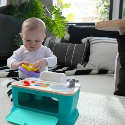 Baby Einstein - mūzikas rotaļlieta MAGIC TOUCH virtuvīte, darbināma ar 3xAA baterijām
