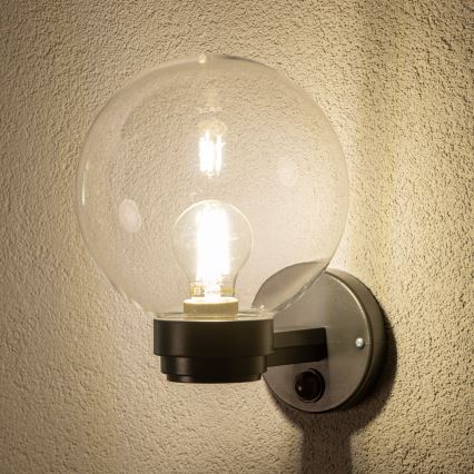 BRILAGI - Āra sienas gaismeklis ar kustības sensoru HARBOR 1xE27/40W/230V IP33 antracīts/caurspīdīgs