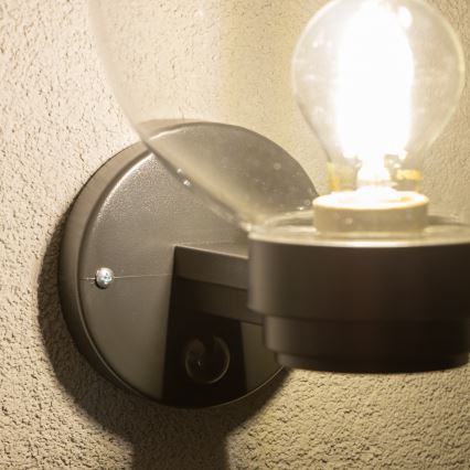 BRILAGI - HARBOR āra sienas gaismeklis ar kustības sensoru, 1xE27/40W/230V, IP33, melns/caurspīdīgs
