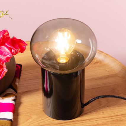 Brilliant - Galda lampa KNUT 1xE27/25W/230V melna/caurspīdīga