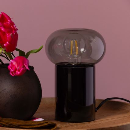 Brilliant - Galda lampa KNUT 1xE27/25W/230V melna/caurspīdīga