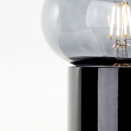 Brilliant - Galda lampa KNUT 1xE27/25W/230V melna/caurspīdīga