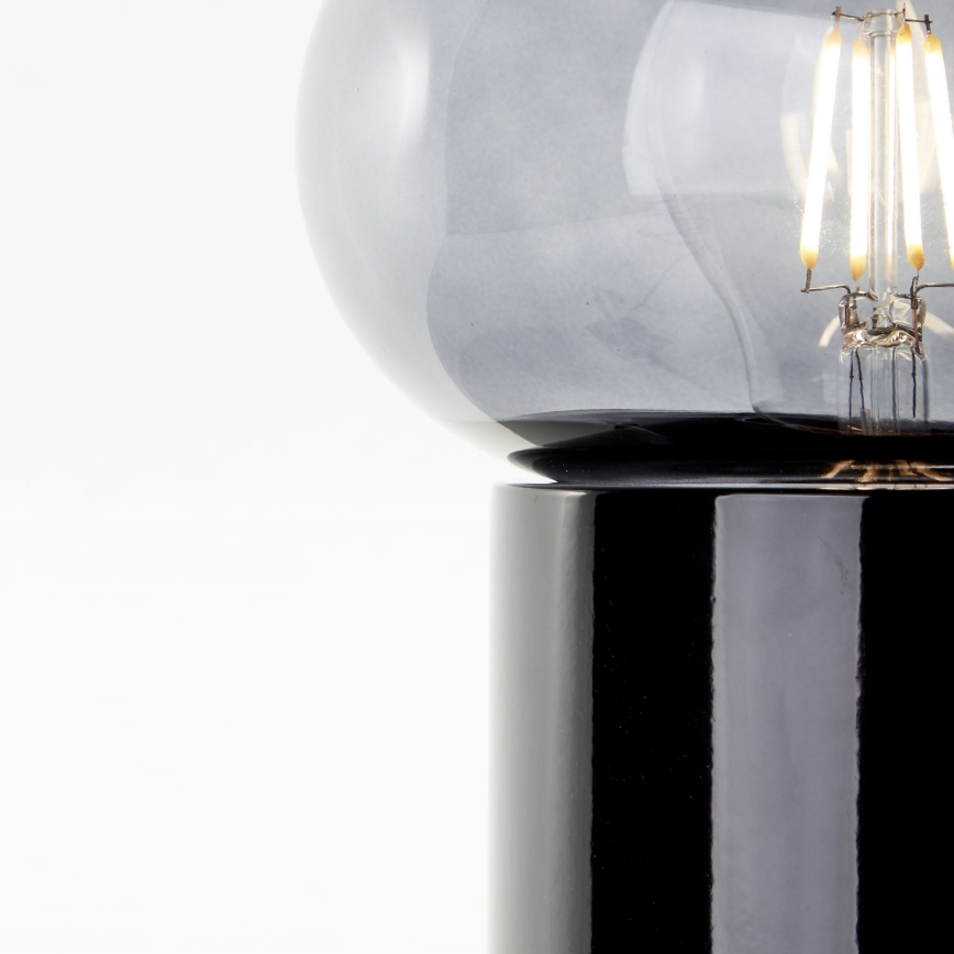 Brilliant - Galda lampa KNUT 1xE27/25W/230V melna/caurspīdīga