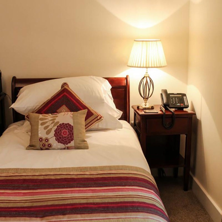 Elstead - Galda lampa AEGEAN 1xE27/60W/230V bronzas krāsā