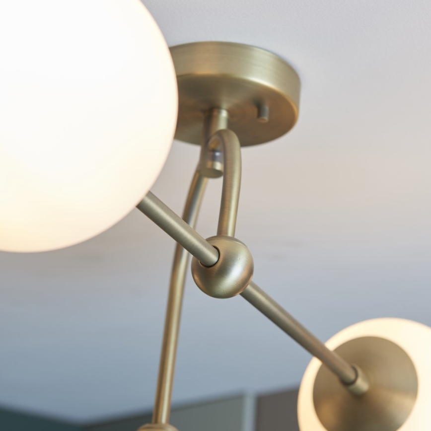Endon 90843 - Virsmas montējamā griestu lustra ONTARIO 4xE14/7W/230V, misiņš
