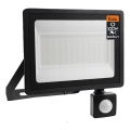LED āra reflektors ar kustības un krēslas sensoru LED/100W/230V 4500K IP65 melns