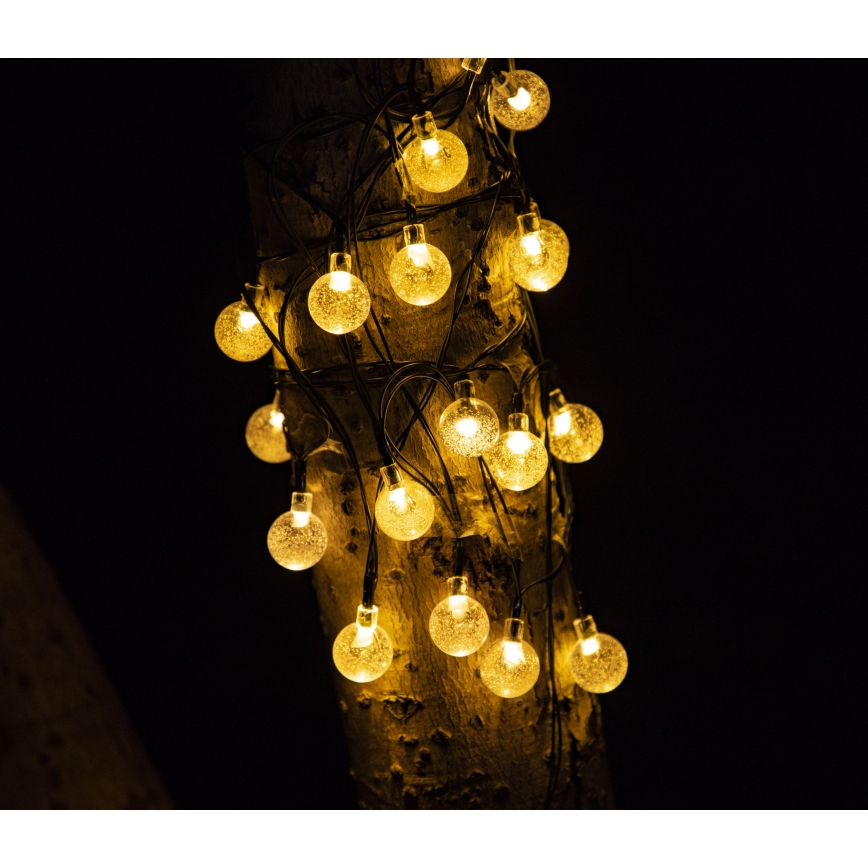 LED Saules enerģijas dekoratīva virtene BUBBLE GLASS 20xLED/8 funkcijas 4,85 m 600 mAh IP44 silti balta