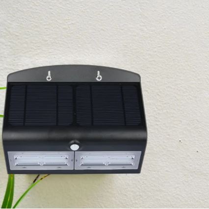 LED Saules enerģijas sienas lampa ar sensoru LED/7W/3,7V 4000K IP65 melna