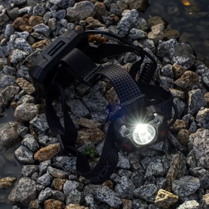 LED Aptumšojama uzlādējams galvas lampa ar sensoru ar lādētājakumulatora funkciju un sarkana lampa LED/10W/5V IP44 1200 spīdīgs 4000 mAh