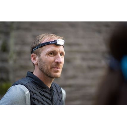 Ledlenser NEO5R - uzlādējamā LED galvas lampa ar regulējamu spilgtumu LED/1800 mAh IP54 600 lm 35 h melna/balta