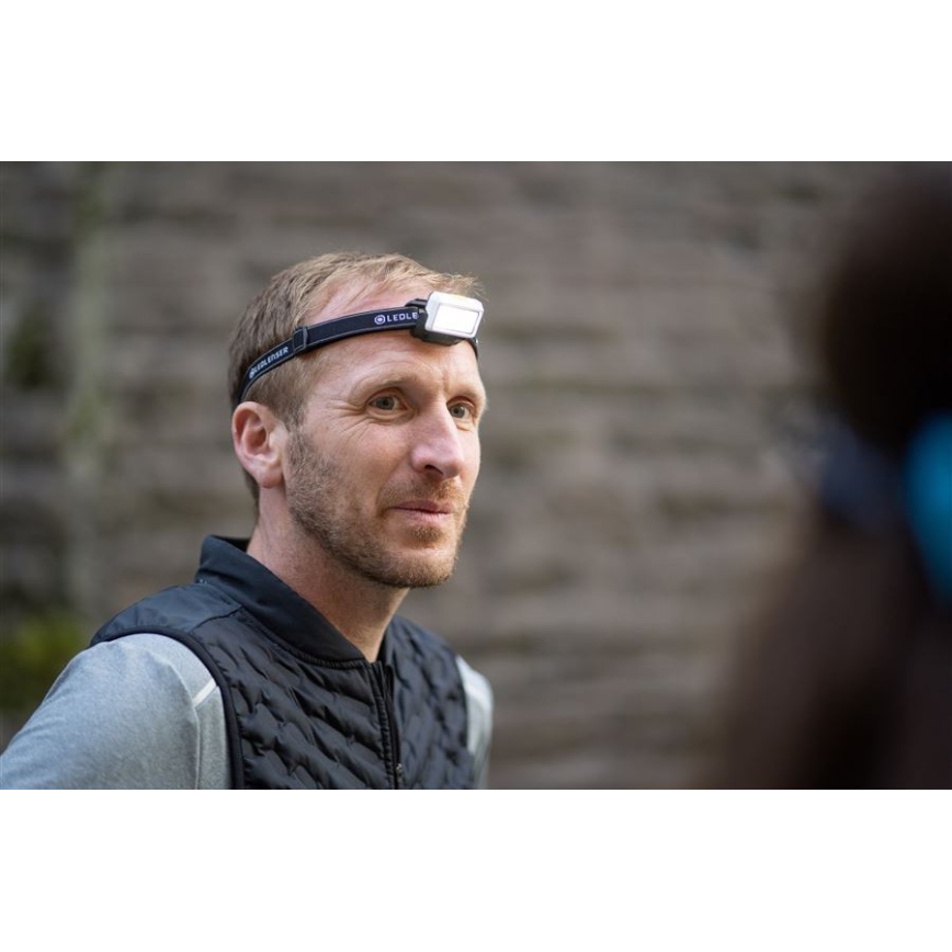 Ledlenser NEO5R - uzlādējamā LED galvas lampa ar regulējamu spilgtumu LED/1800 mAh IP54 600 lm 35 h melna/balta