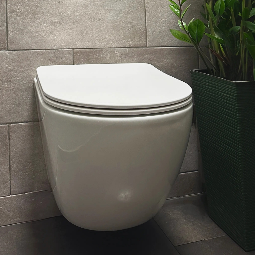 REA-C1259 - Pakarināms WC ar tualetes sēdekli CARLO MINI TORNADO RIMLESS keramika/spīdīgi balta