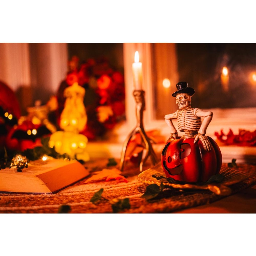 LED Rotājums HALLOWEEN LED/2xLR44/silti balta skelets ķirbī sveķi