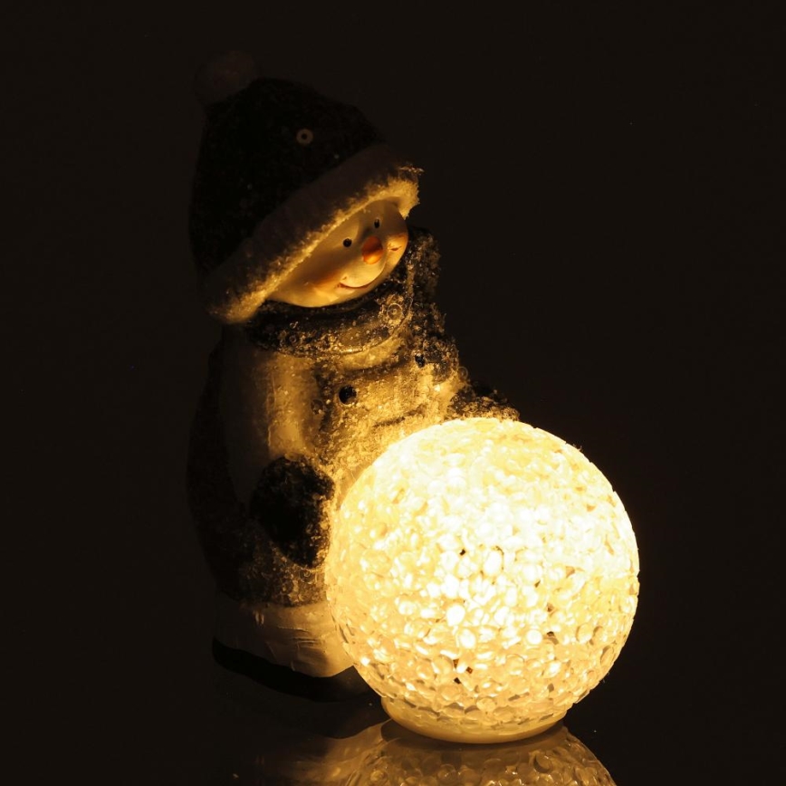 LED Ziemassvētku rotājums LED/2xLR44/silti balta sniegavīrs ar sniega bumbu